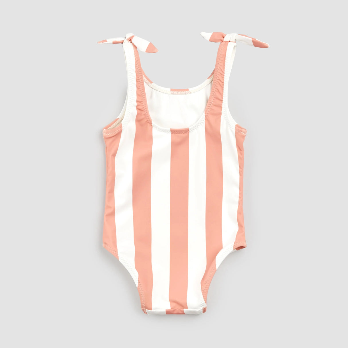 Front view of coral striped girls swimwear bodysuit on light background showing knotted shoulder ties.