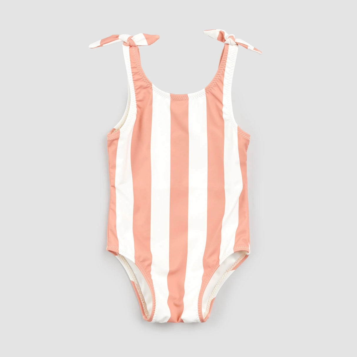 Coral and white striped Petit Lem one-piece swimsuit flat lay with knotted straps for baby girl and girl.