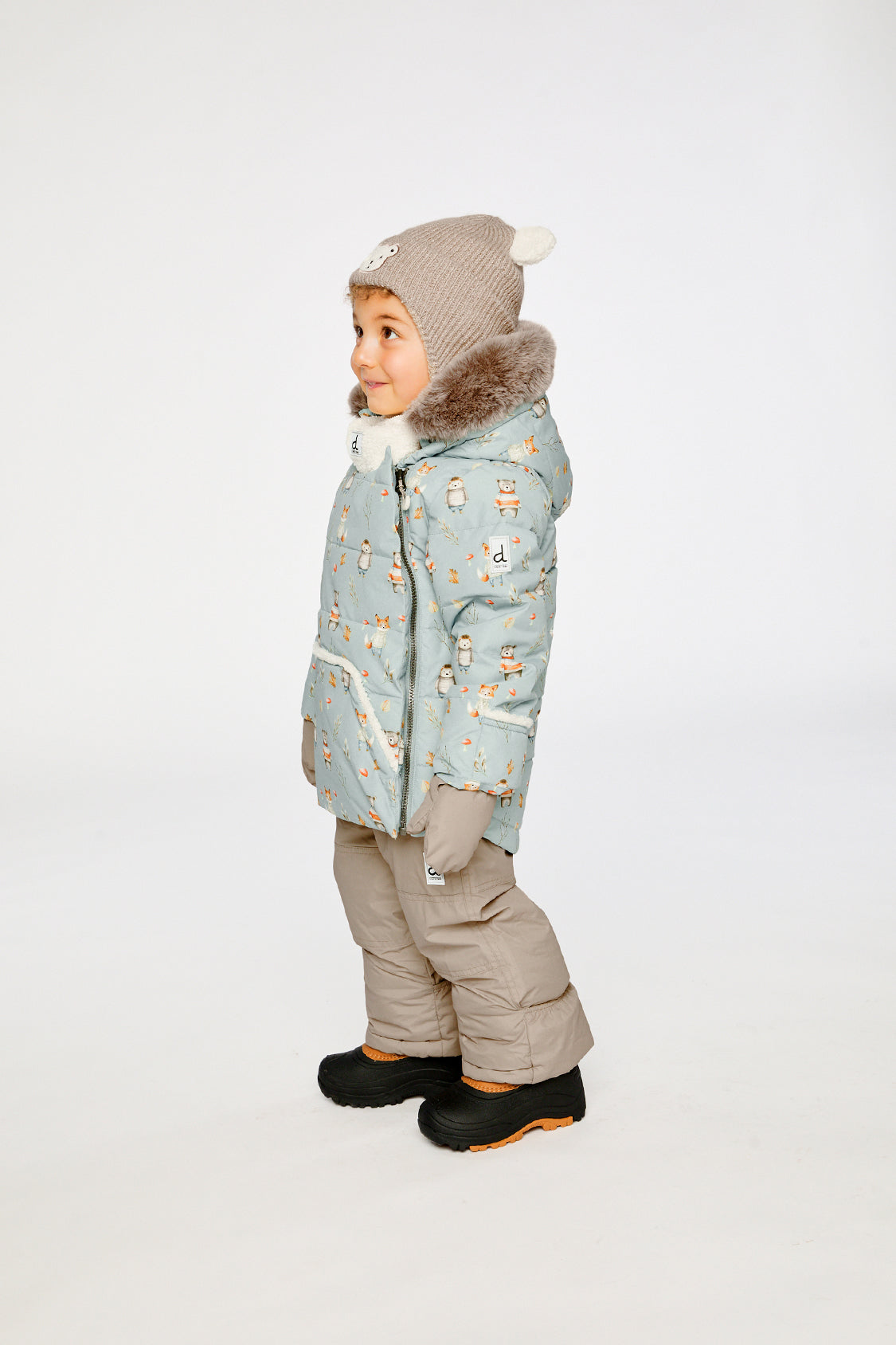 Deux par Deux baby two-piece snowsuit in Blue Animal Print shown from an alternate modeled winter angle