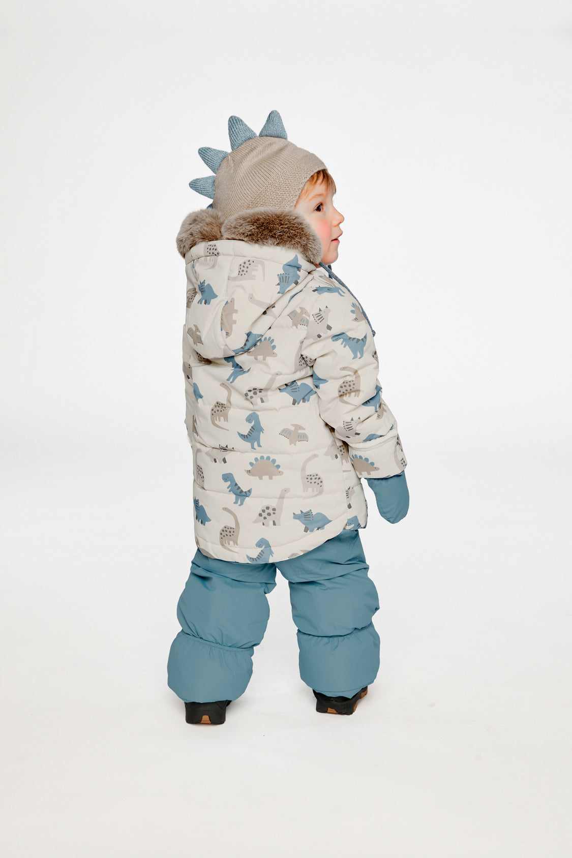 Alternate winter lookbook view of the Deux par Deux baby two-piece snowsuit in Blue Dinosaur Print