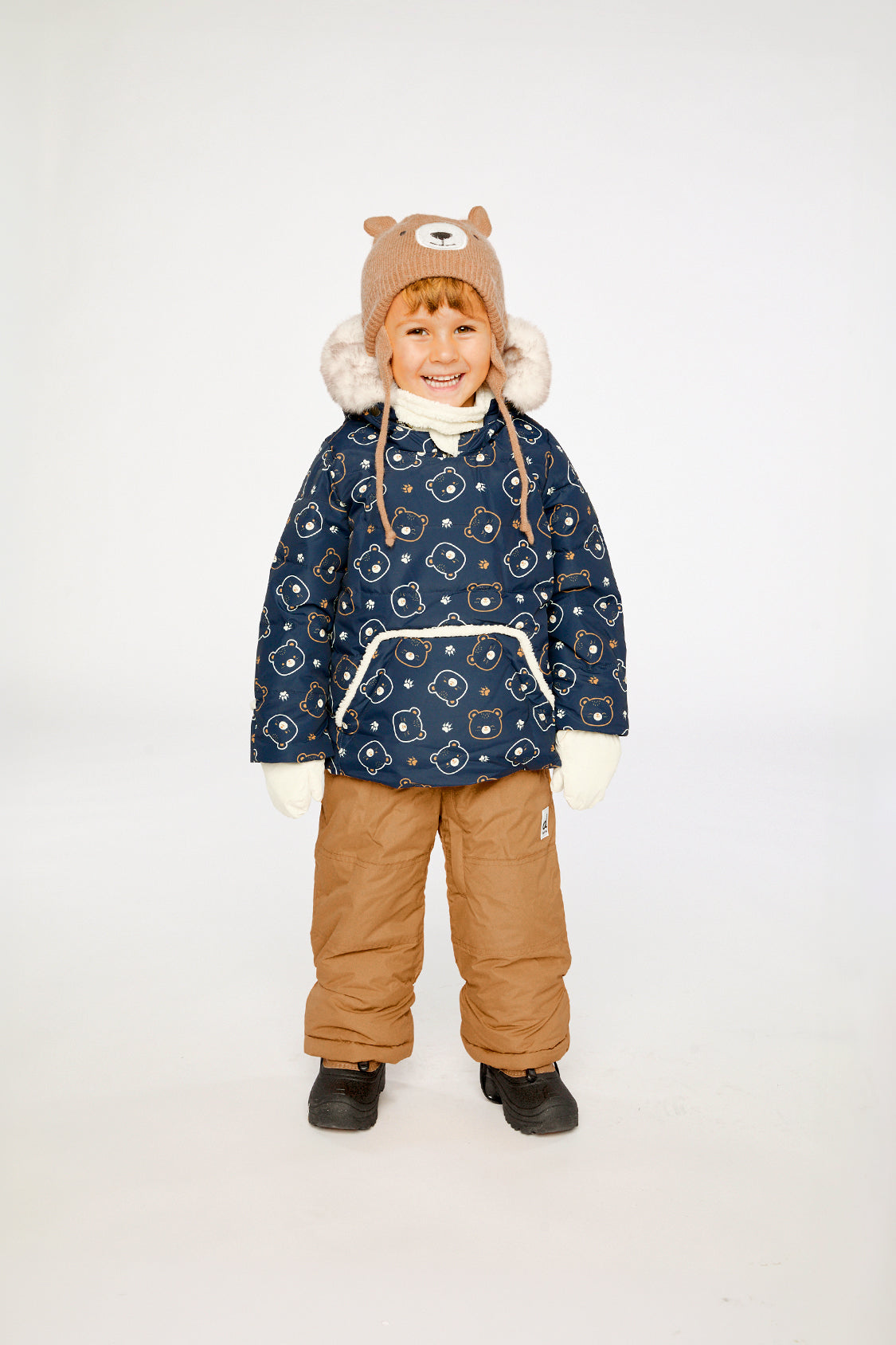 Baby wearing the Deux par Deux baby two-piece snowsuit in Blue Printed Teddy Bears in a winter lookbook view