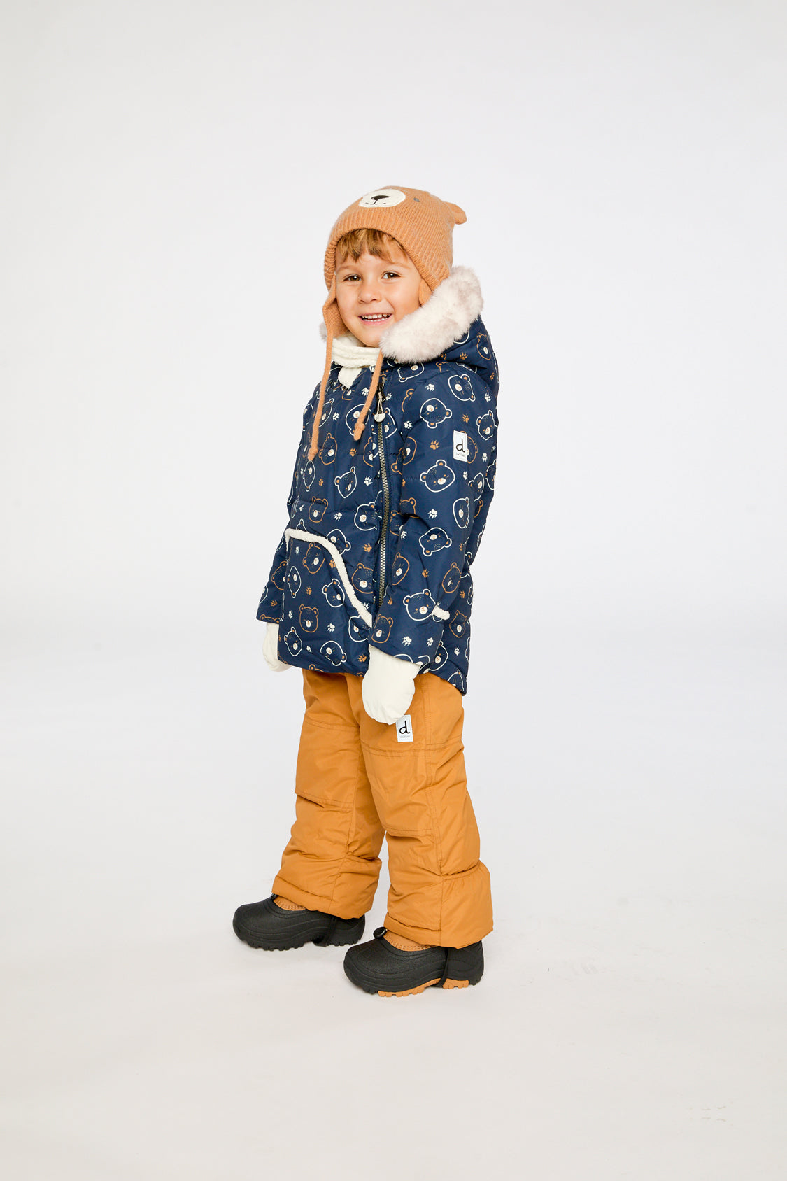 Deux par Deux baby two-piece snowsuit in Blue Printed Teddy Bears shown from an alternate modeled winter angle