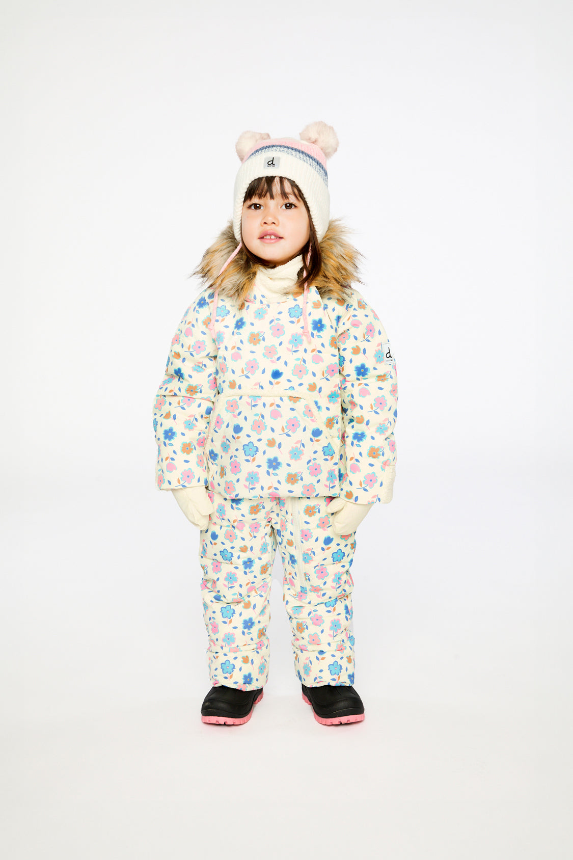 Baby girl wearing Deux par Deux white floral Baby Snug snowsuit with faux fur hood