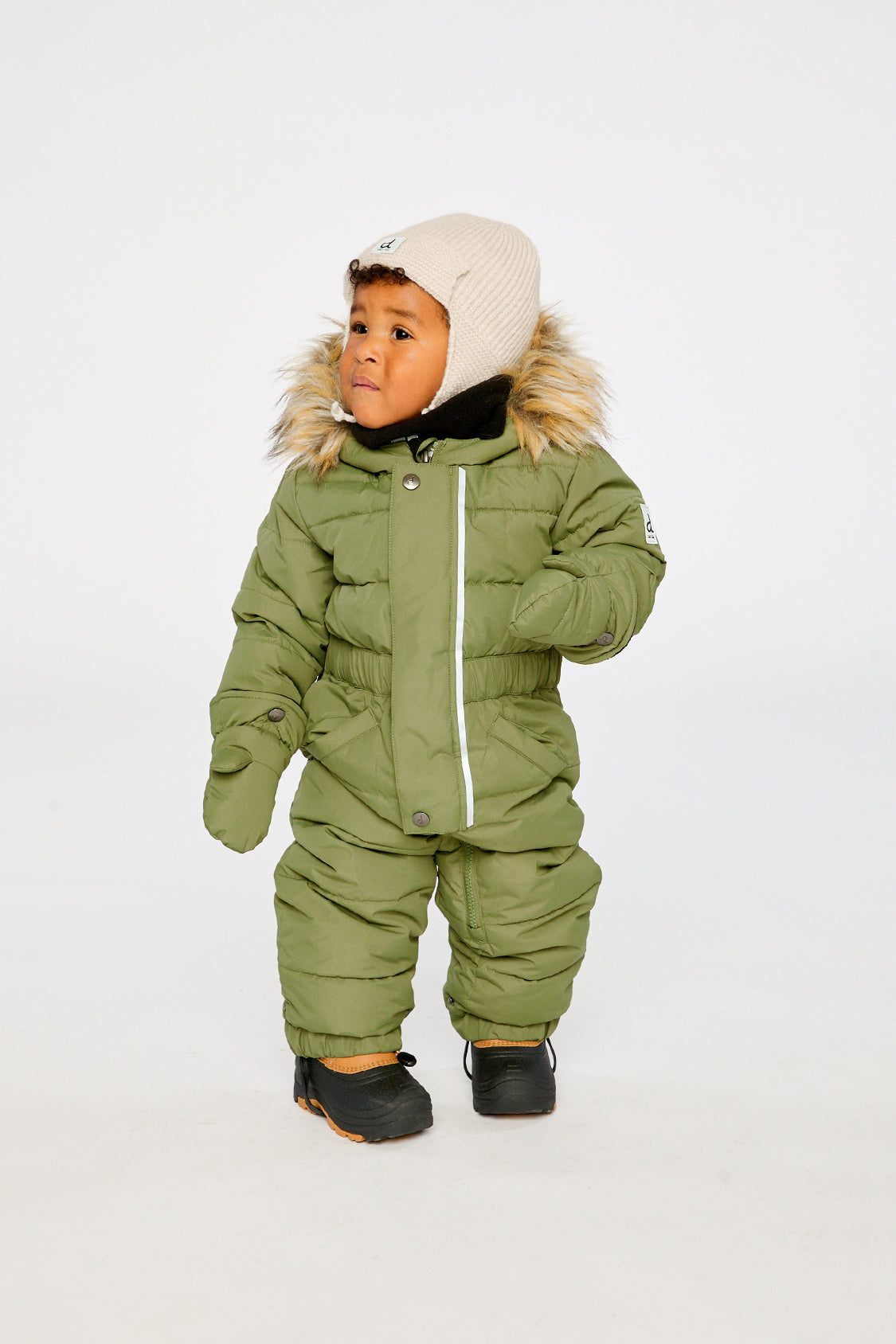 Baby wearing Deux par Deux olive green puffy snowsuit with removable mittens and booties