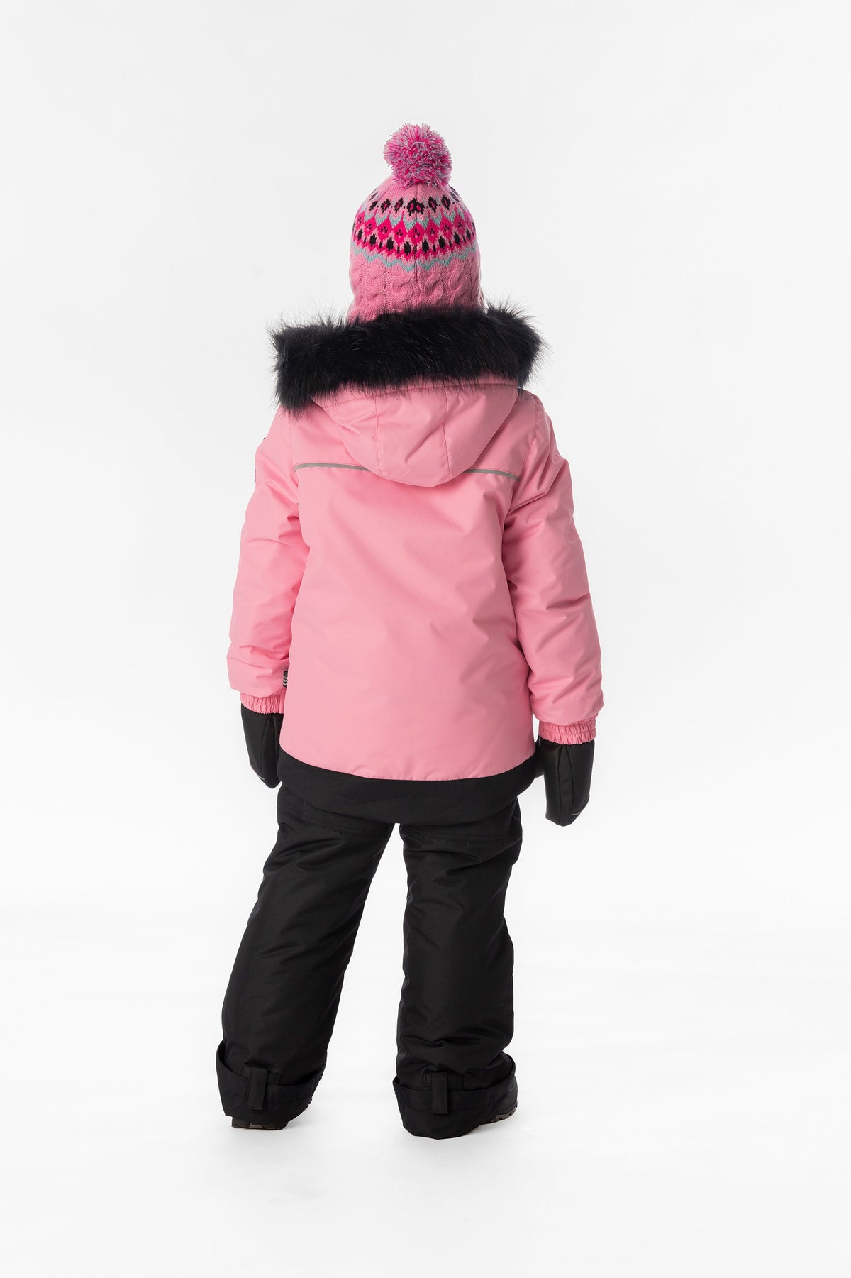 Girl in the pink and black Deux par Deux DISCOVER snowsuit, back view