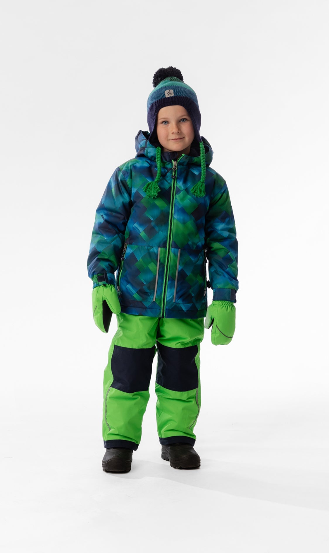 Front view of a child wearing the blue and green checkered CHILL snowsuit with bright green snow pants
