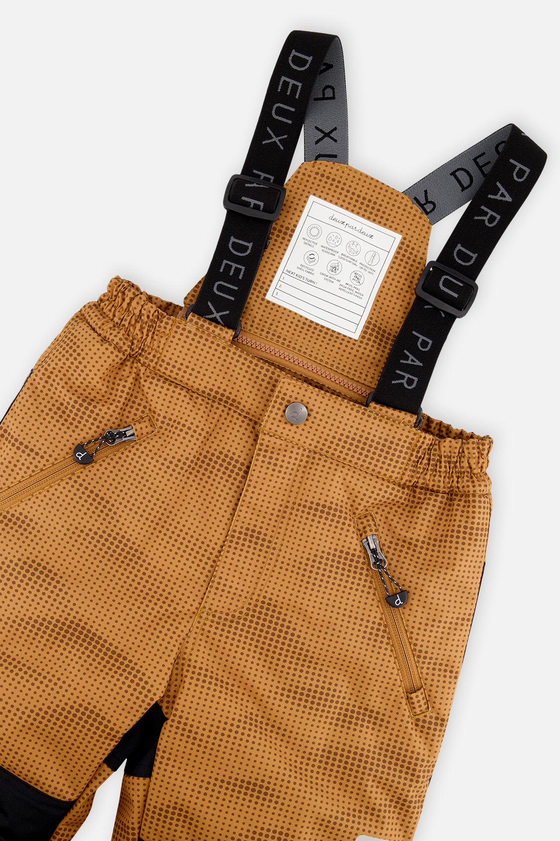 Deux par Deux boys PLAY snowsuit, brown and black – close-up of the suspenders and zippered pant pockets