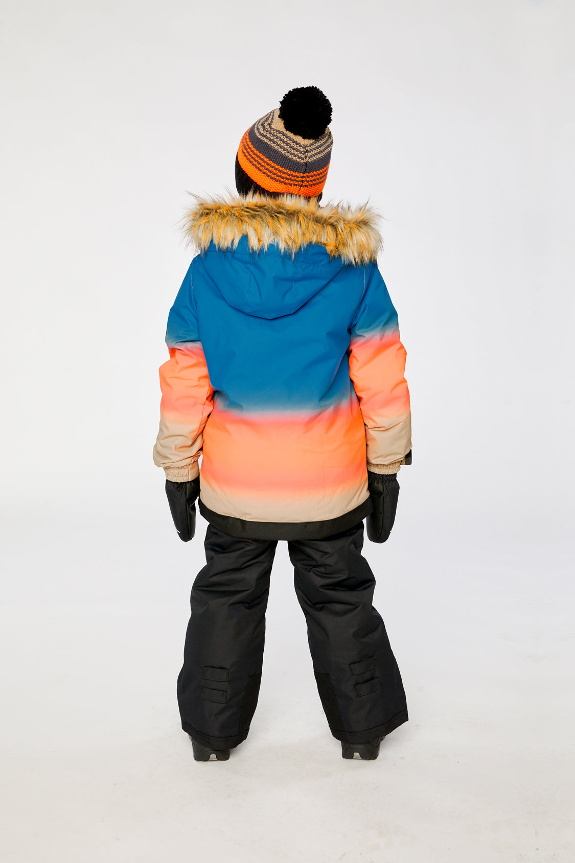 Alternate winter lookbook view of the Deux par Deux PLAY two-piece snowsuit in Blue and Orange Gradient