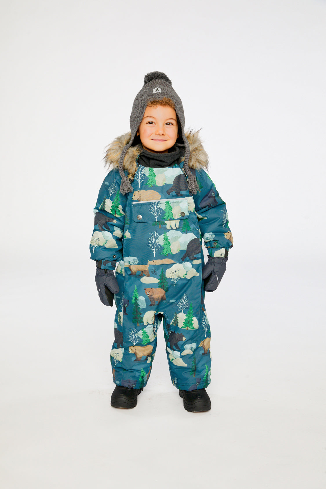 Baby boy wearing the Deux par Deux blue bear print one-piece snowsuit designed for car seat and stroller outings.