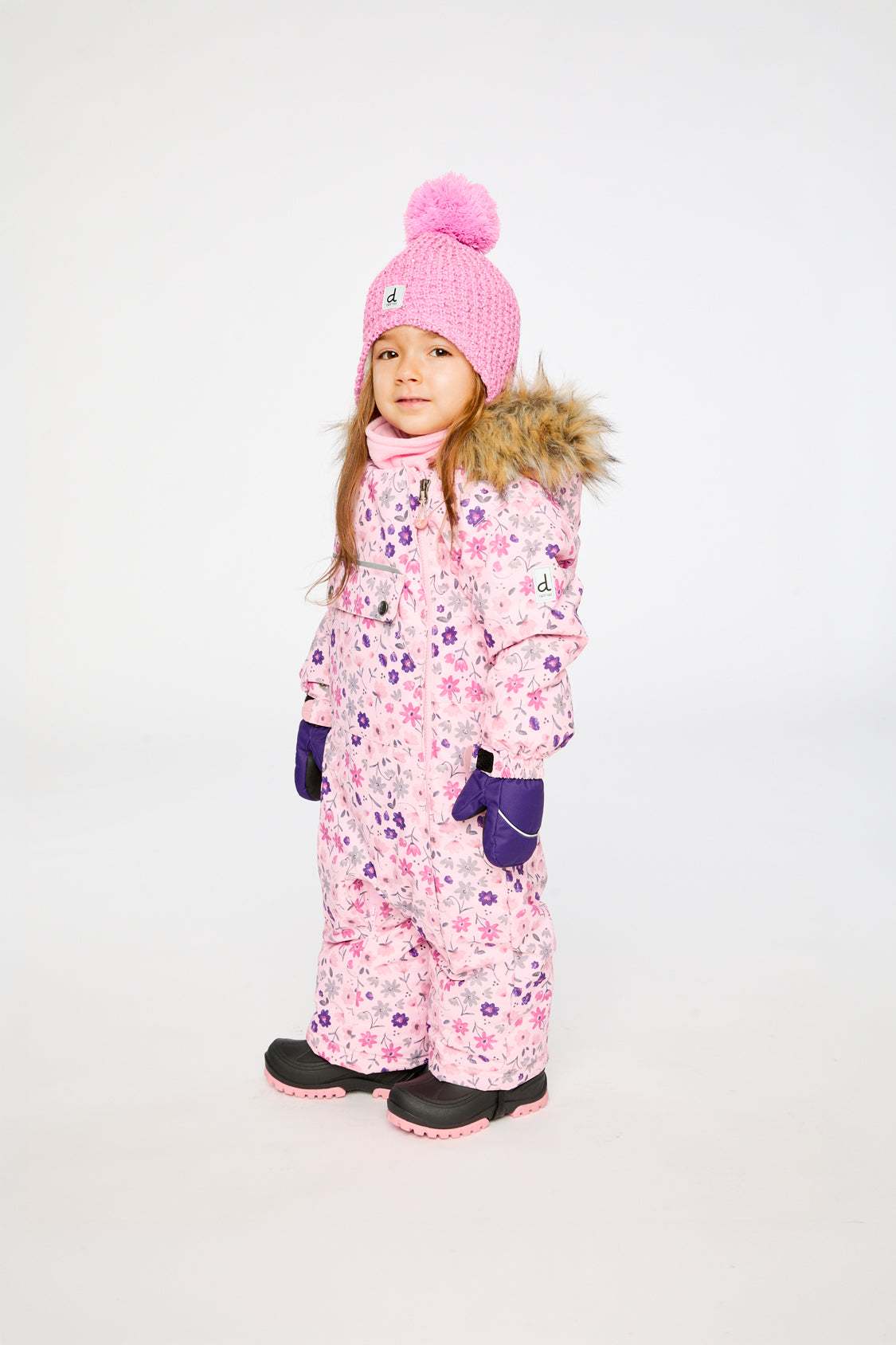 Deux par Deux pink mini flower baby one-piece snowsuit shown from an alternate modeled angle