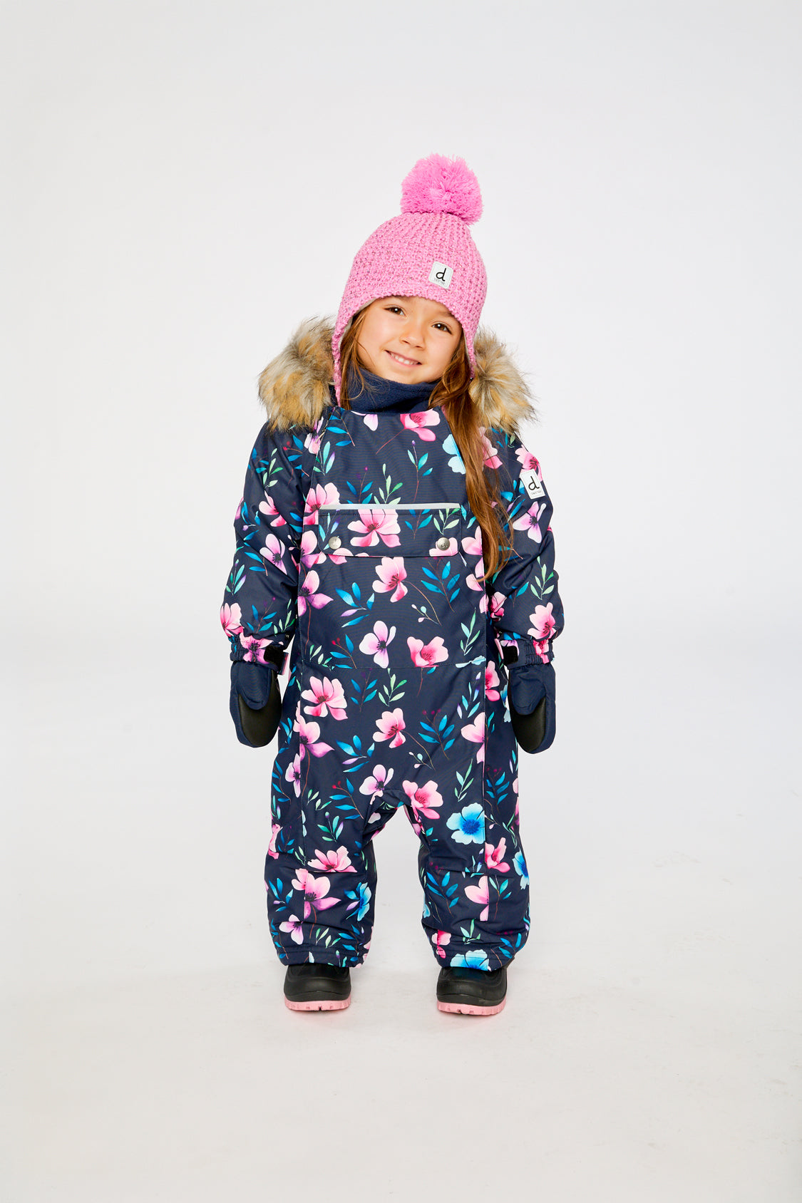 Baby wearing the Deux par Deux baby car-seat one-piece snowsuit in Blue Floral Print in a winter lookbook view
