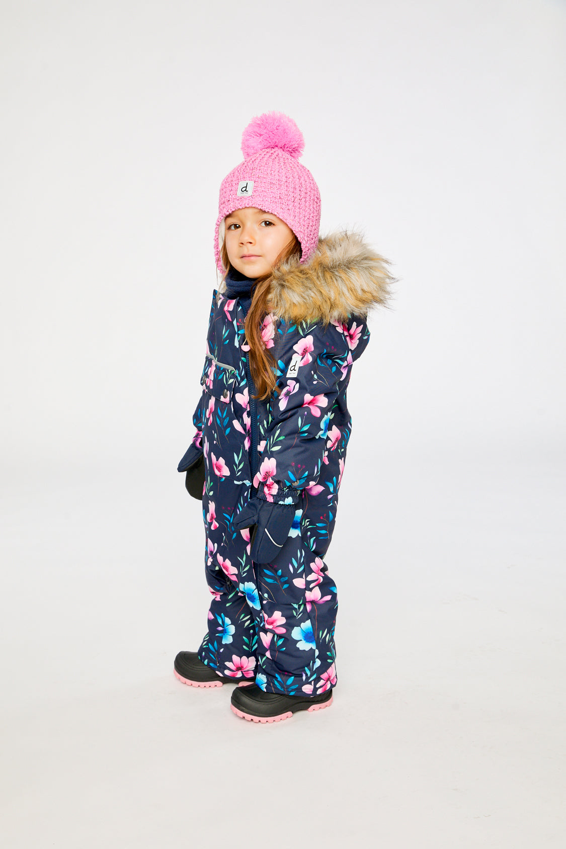Deux par Deux baby car-seat one-piece snowsuit in Blue Floral Print shown from an alternate modeled winter angle