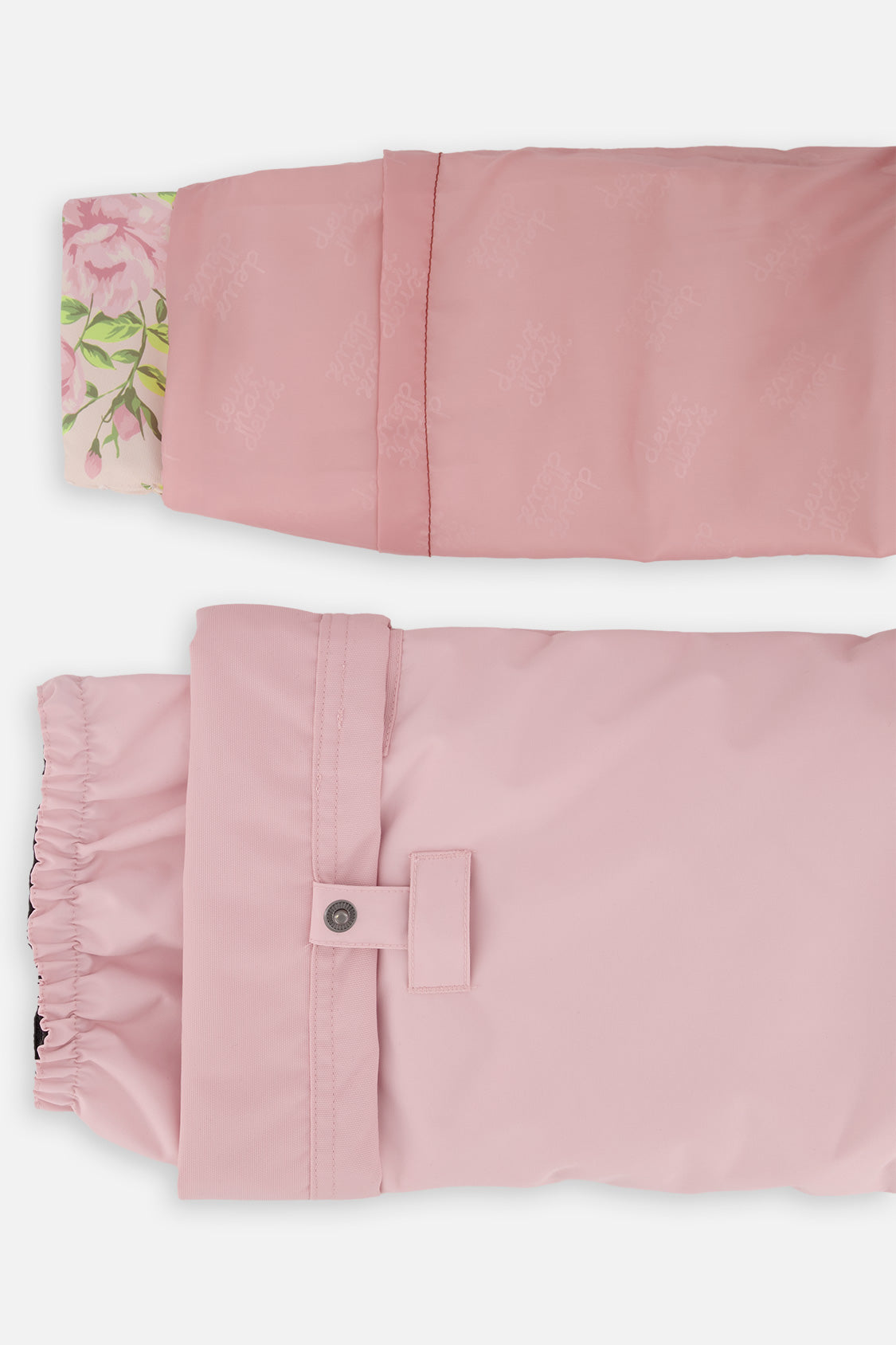 Close-up of the PLAY jacket cuff and the adjustable snow pant hem with snap tab