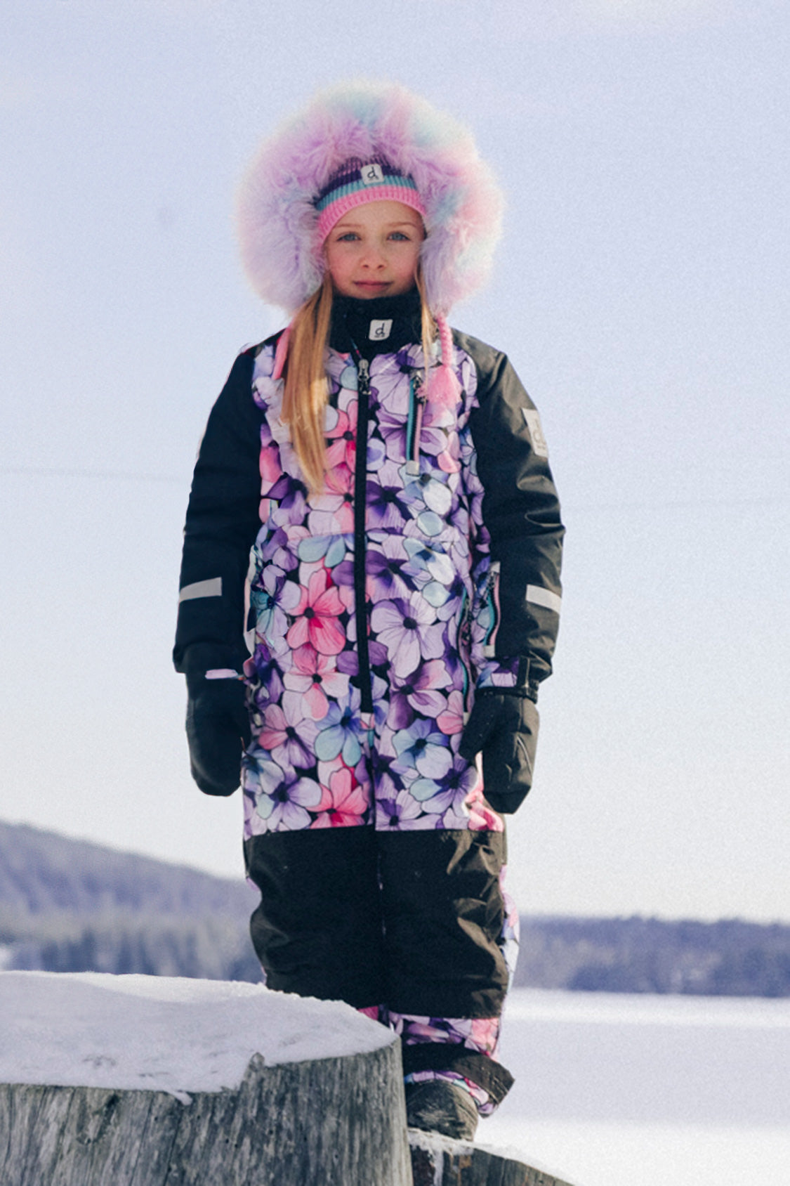 Girls Deux par Deux purple floral PLAY snowsuit shown as a streamlined one-piece winter suit.