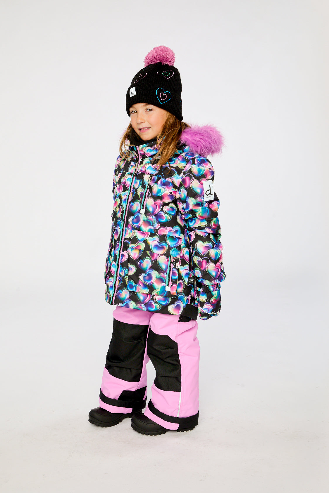 Deux par Deux girls PLAY winter snowsuit in black heart print and pink with grow-with-me construction