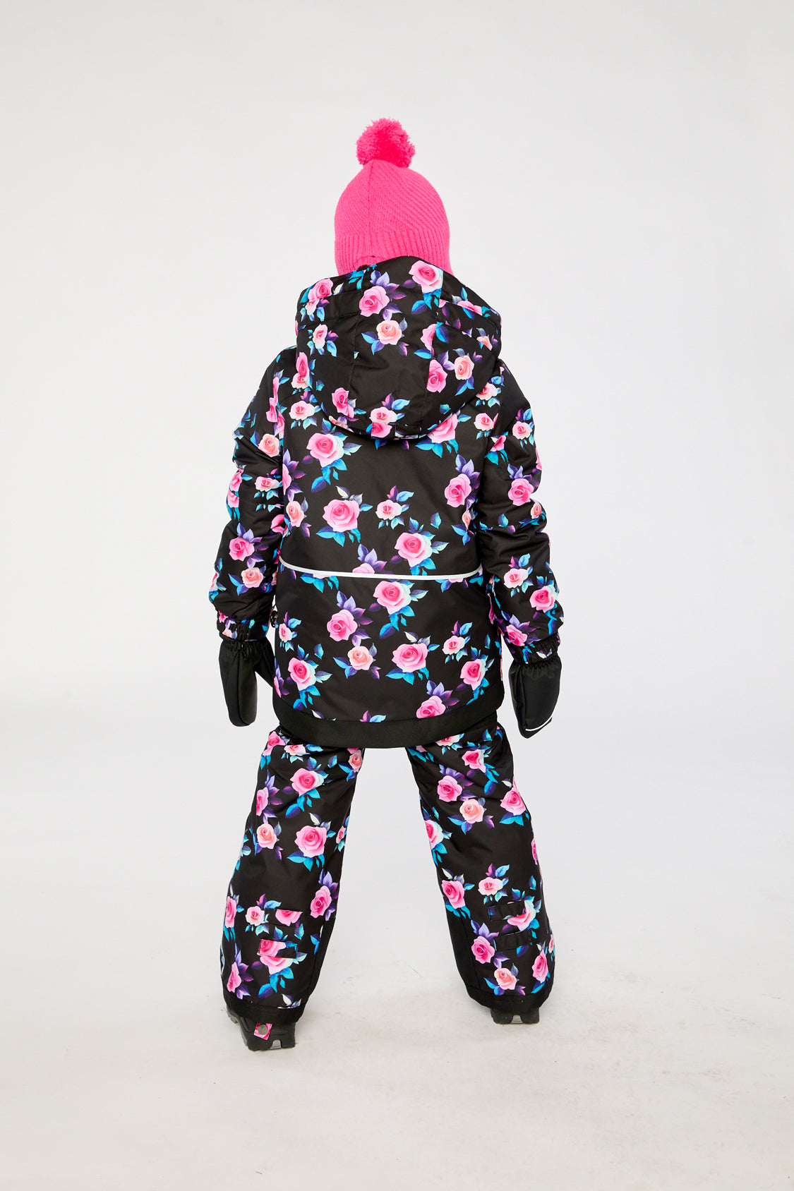 Girl in Deux par Deux -30°C black rose snowsuit with floral jacket and snow pants