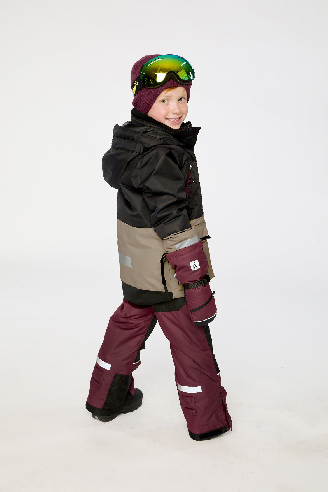 Kids TEKNIK two-piece snowsuit in black beige burgundy shown in an alternate lookbook view