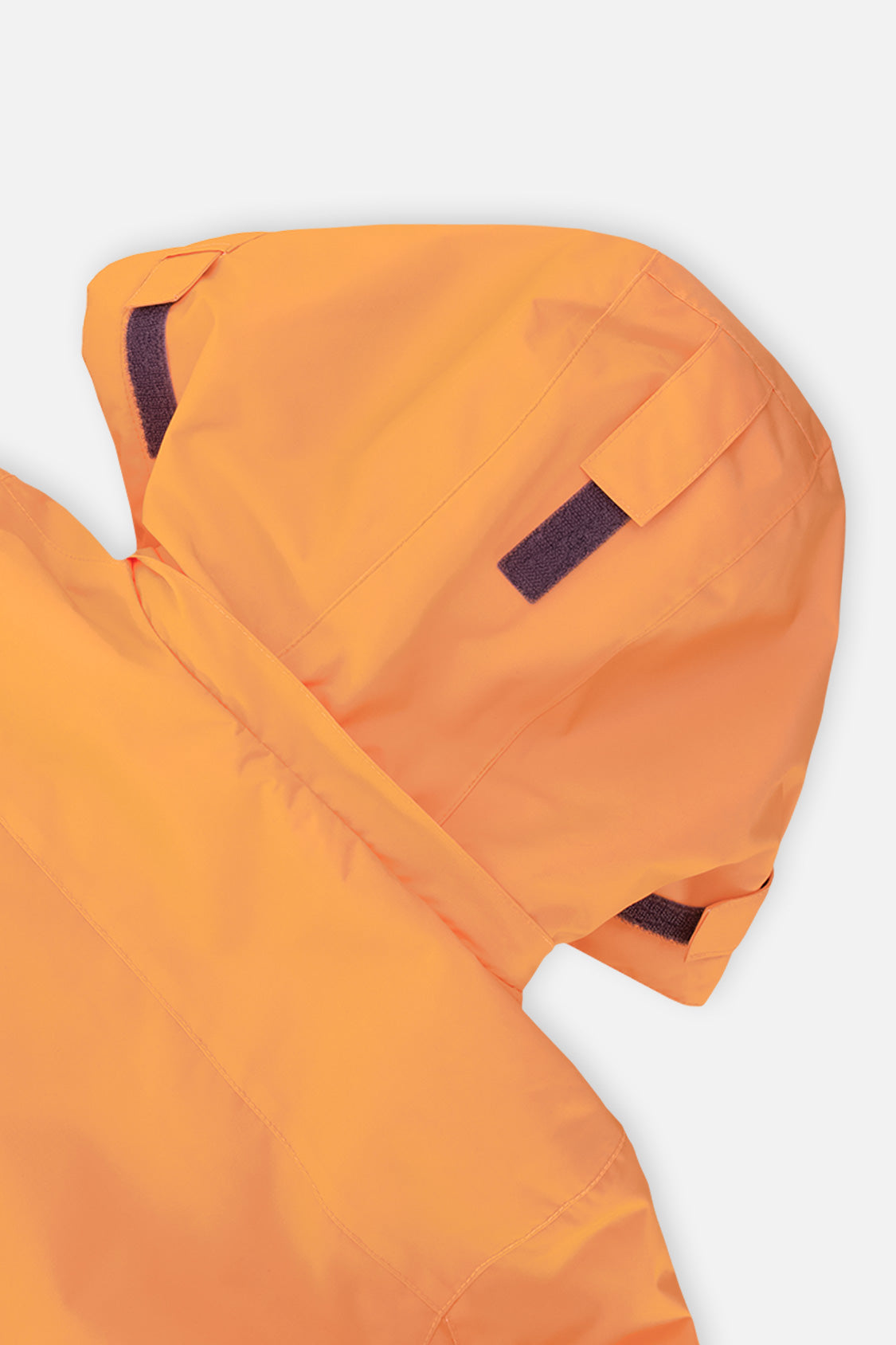 Close-up of the orange and grey TEKNIK jacket hood