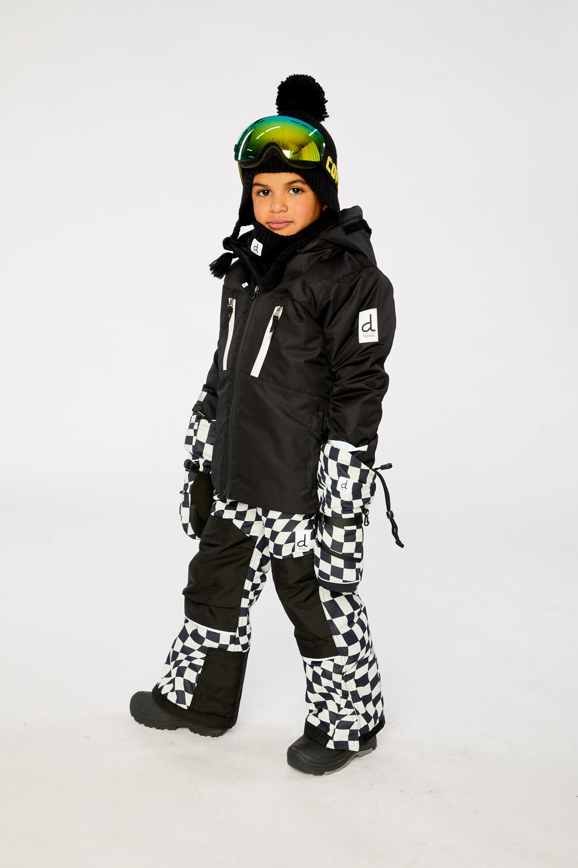 Deux par Deux boys Teknik snowsuit with black jacket and white checkered snow pants