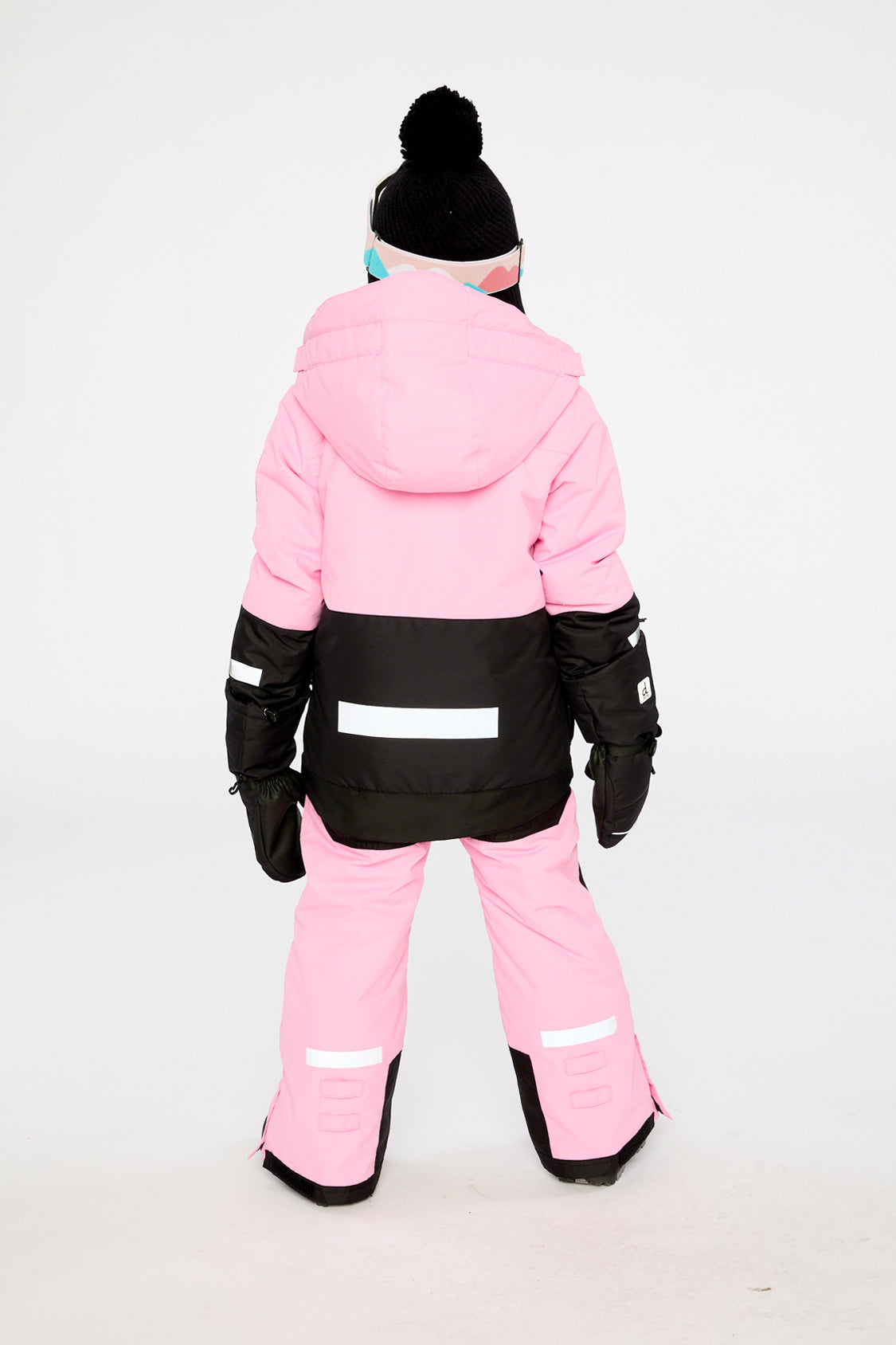 Child wearing the pink Deux par Deux Teknik two-piece snowsuit, lookbook photo 4
