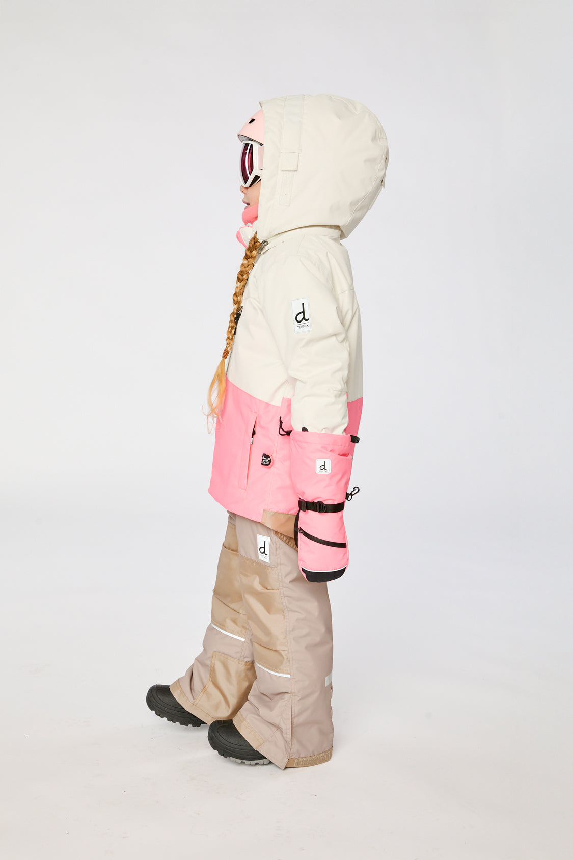 Alternate winter lookbook view of the Deux par Deux TEKNIK two-piece snowsuit in Off-White and Pink