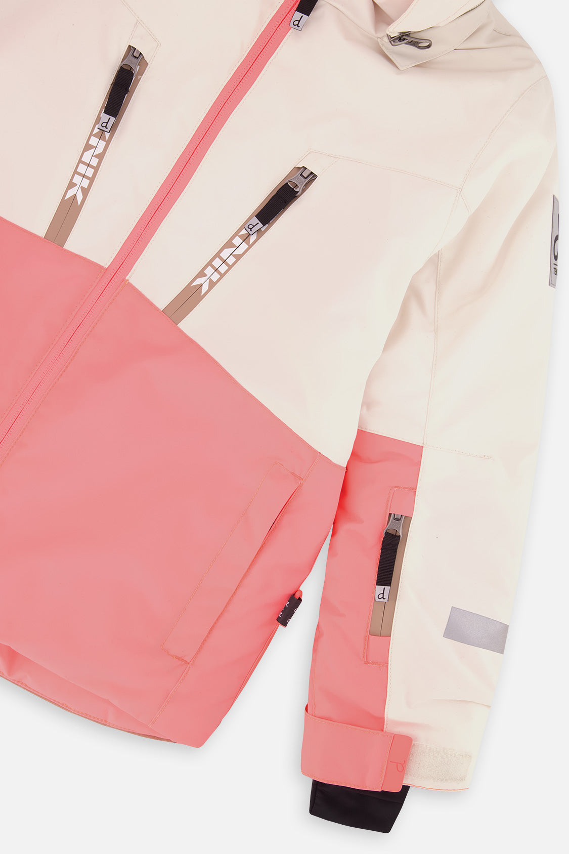 Close-up of the chest zip pockets and sleeve on the off-white and pink TEKNIK jacket