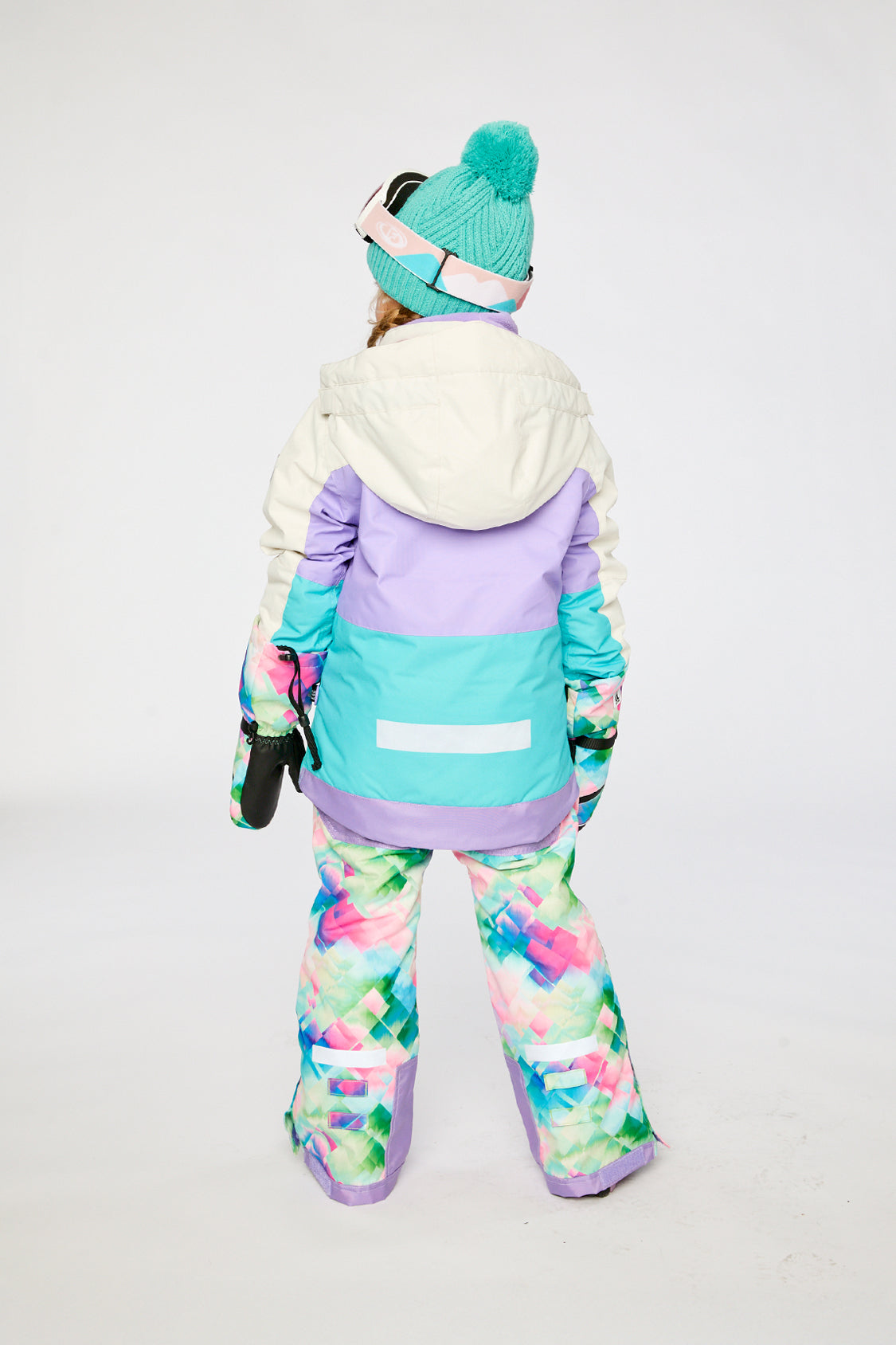 Alternate winter lookbook view of the Deux par Deux TEKNIK two-piece snowsuit in Multicolored with A Diamond Pattern