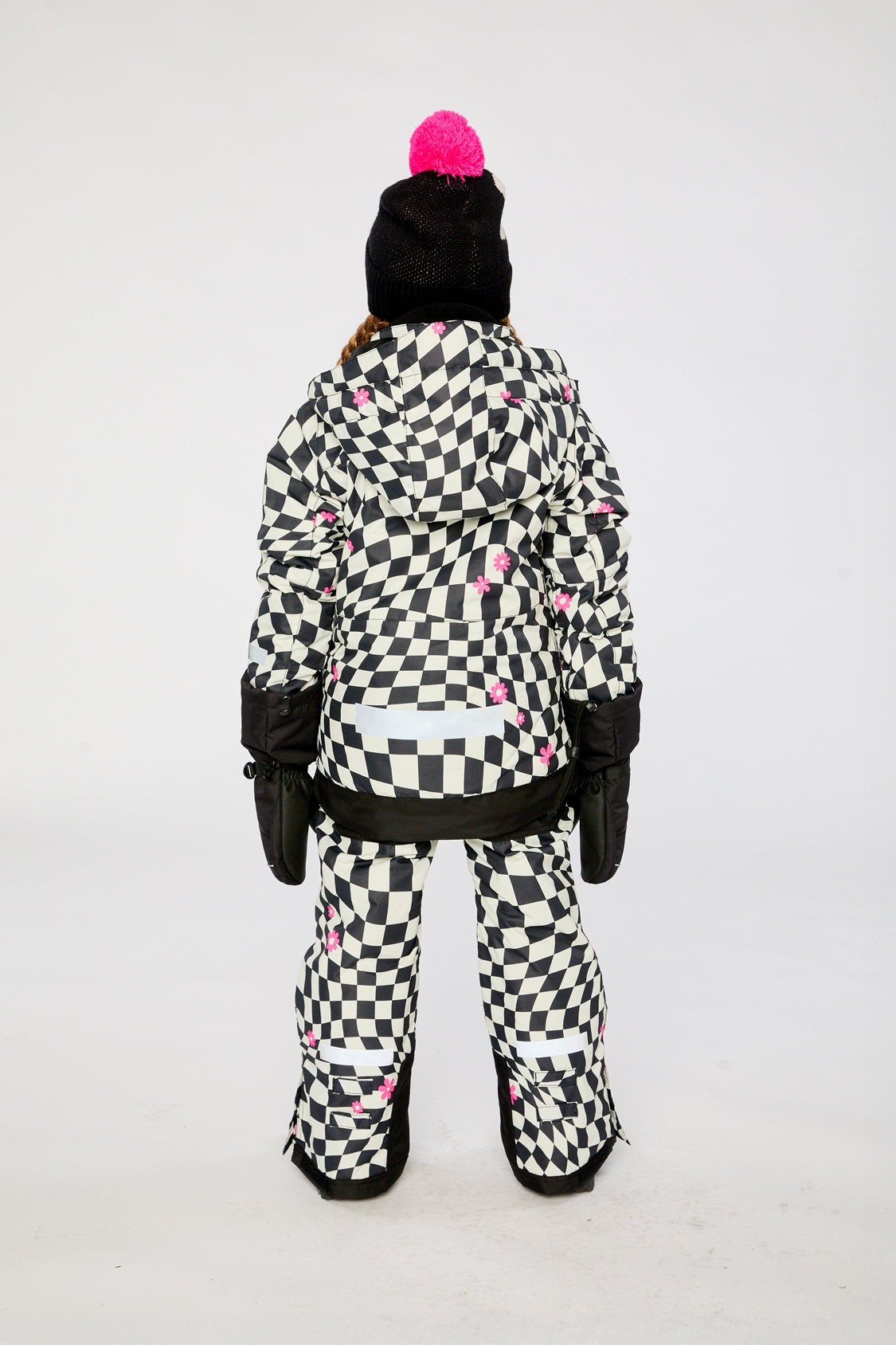 Alternate winter lookbook view of the Deux par Deux TEKNIK two-piece snowsuit in White and Bright Pink Checkered Print