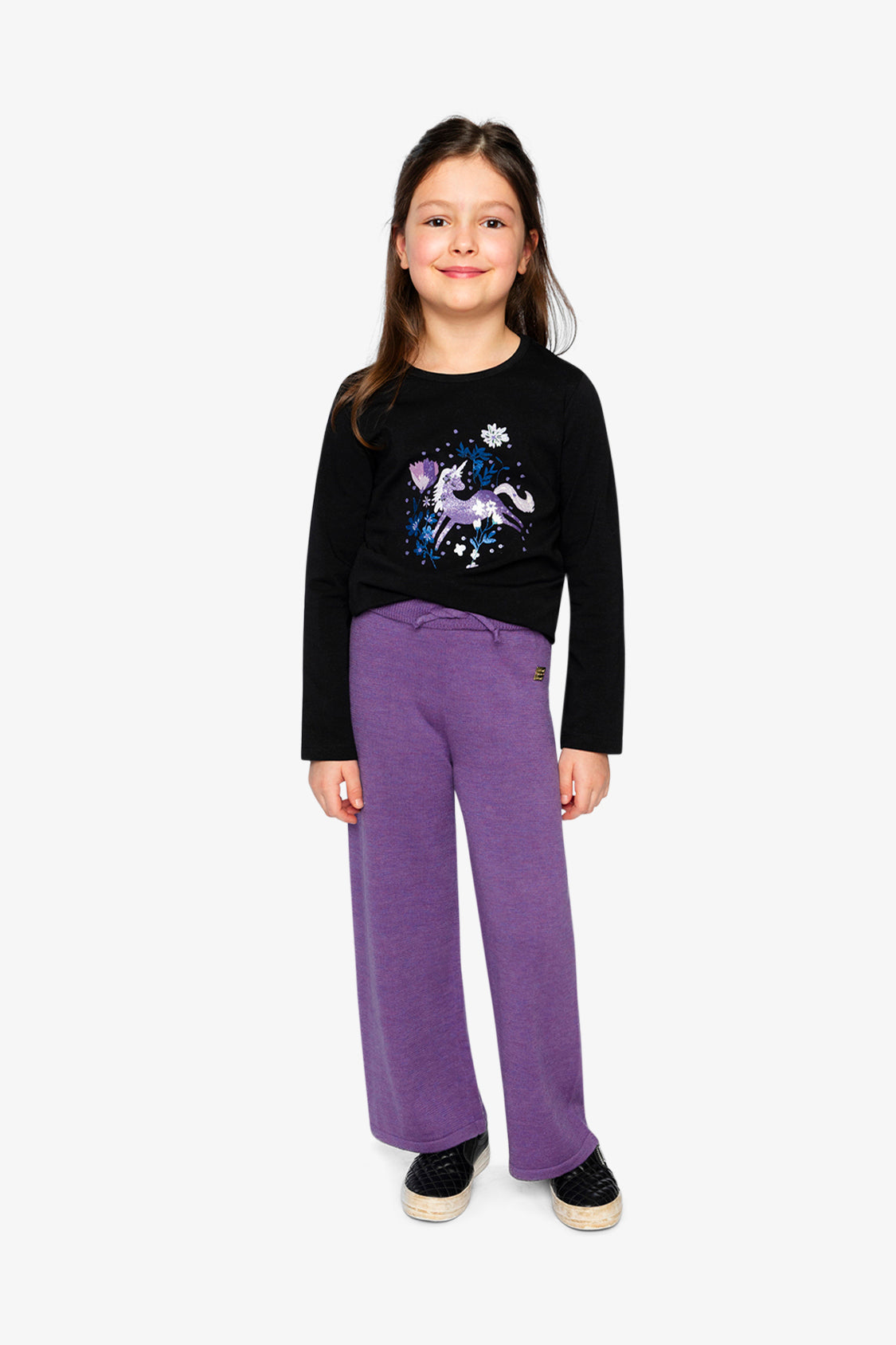 Child wearing Deux par Deux black and mauve long sleeve tee with glitter unicorn, full outfit lookbook view