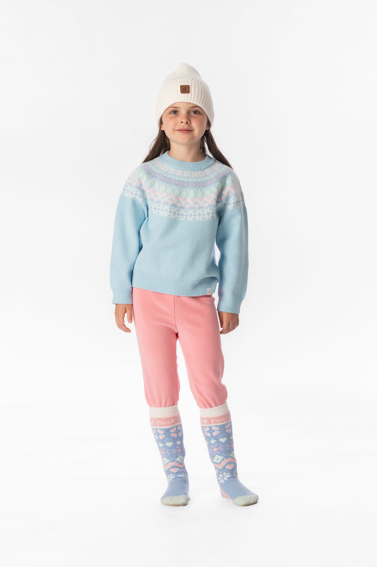 Child wearing the Deux par Deux light blue Nordic jacquard sweater