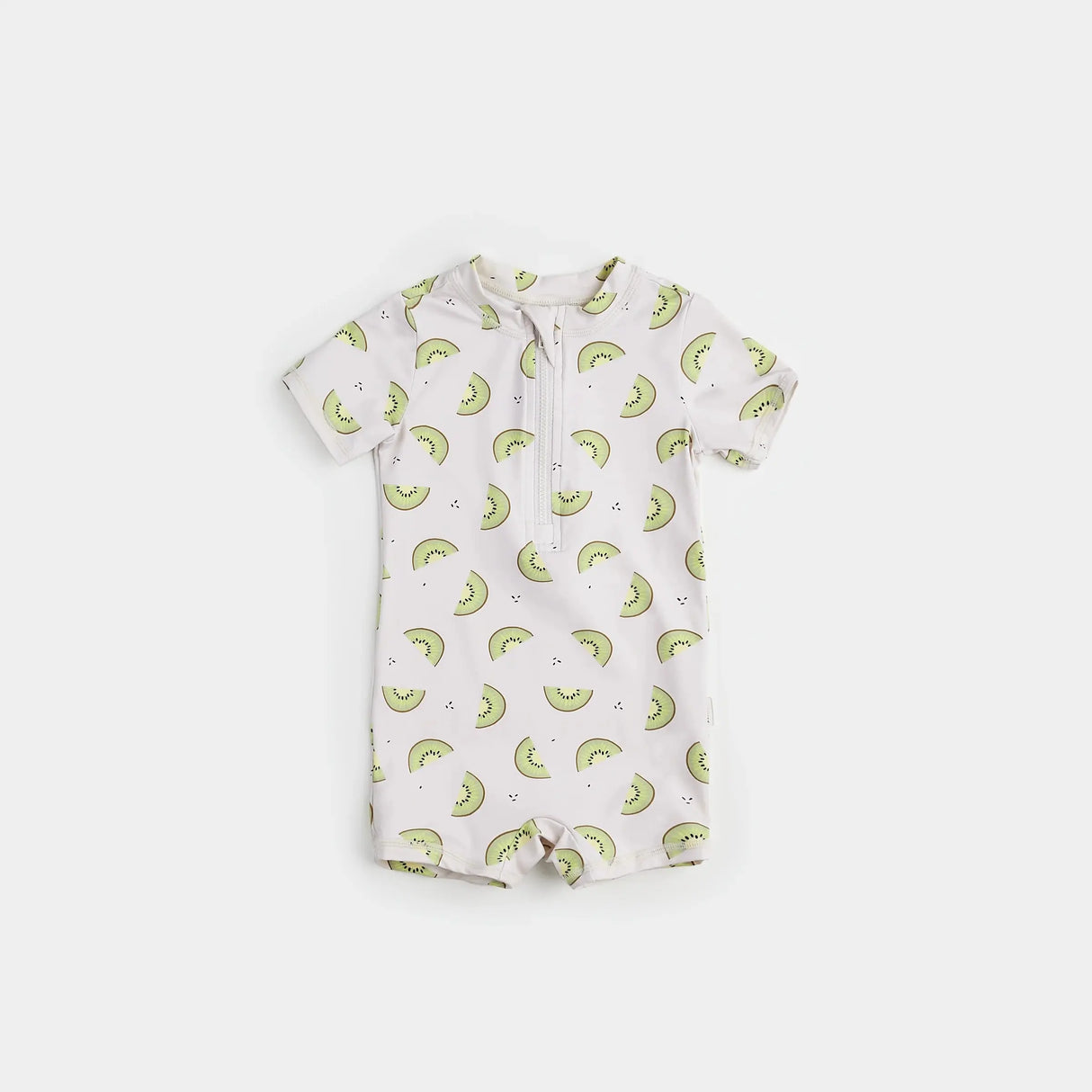 Kiwi print baby boy swim romper in crème and green on neutral background.