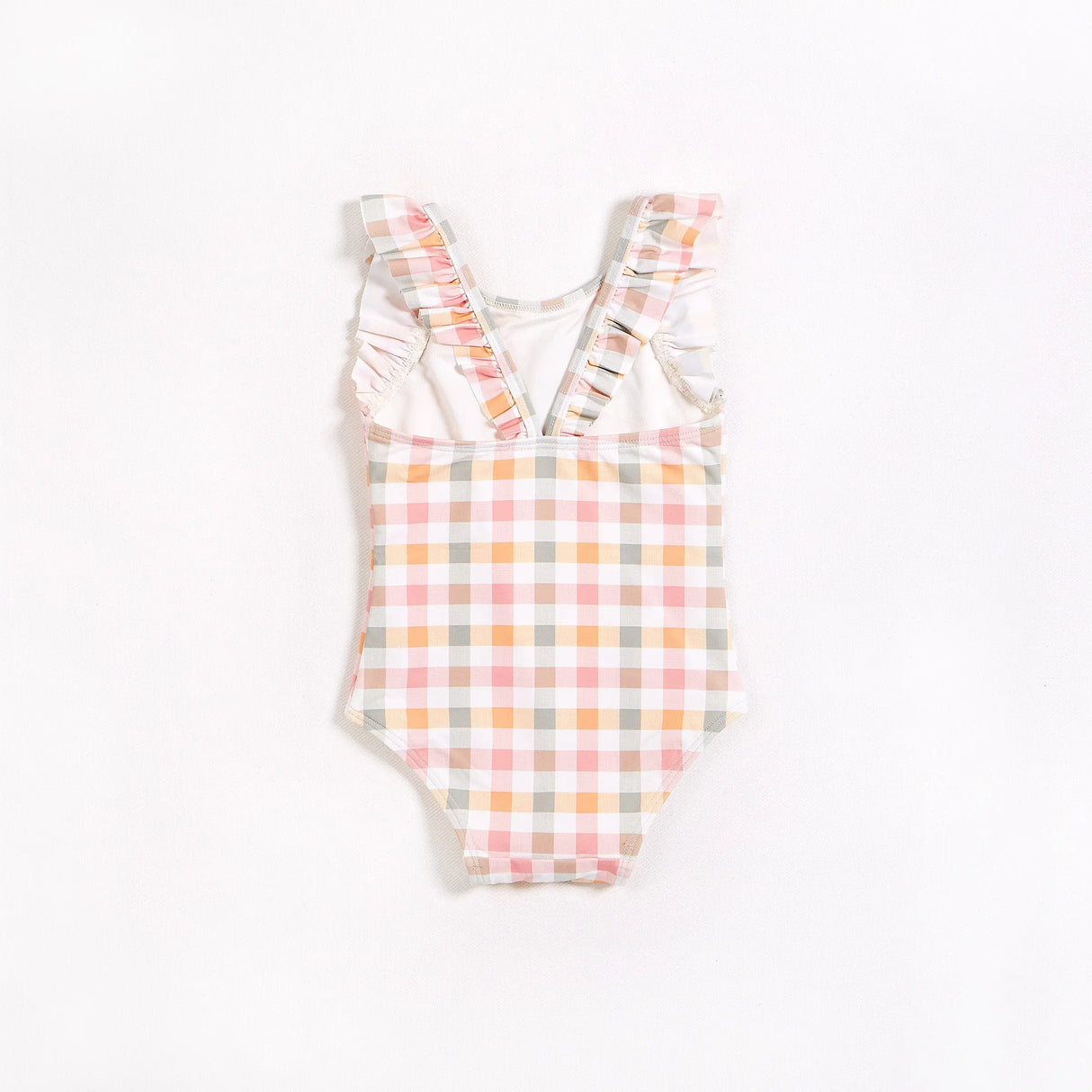 Front view of pastel gingham ruffle strap one-piece swimsuit for little girls on plain backdrop.