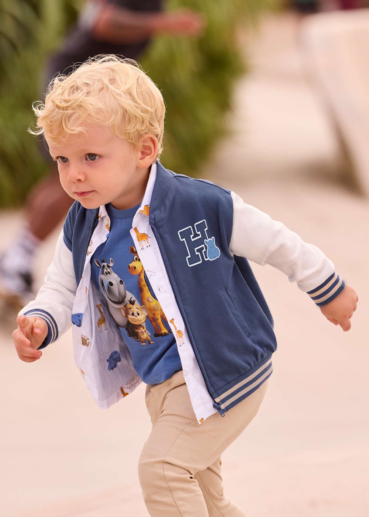 Baby boy wearing Mayoral Navy bomber jacket for a sporty everyday outfit.
