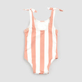 Front view of coral striped girls swimwear bodysuit on light background showing knotted shoulder ties.