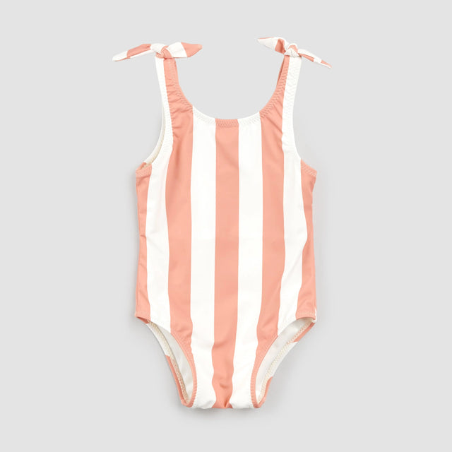 Coral and white striped Petit Lem one-piece swimsuit flat lay with knotted straps for baby girl and girl.