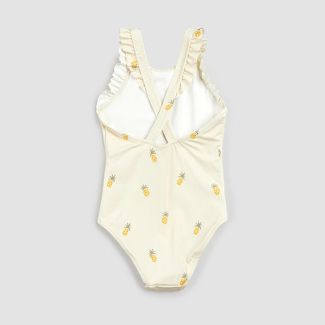 Back view of baby girl pineapple-print swimsuit with cross-over ruffle straps