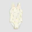 Front flat lay of Petit Lem birch one-piece swimsuit with yellow pineapple print and ruffled straps