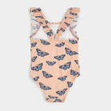 Full view of Petit Lem monarch butterfly kids swimsuit in papaya for baby girl and girl sizes