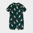 Deep sky pelican-print baby swim romper laid flat showing short sleeves and zipper front.