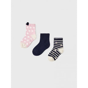 Three pairs of Mayoral baby girl socks in pink, navy and white patterns