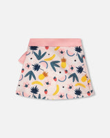 Back or angled view of pink fruit-print cover-up skirt for girls