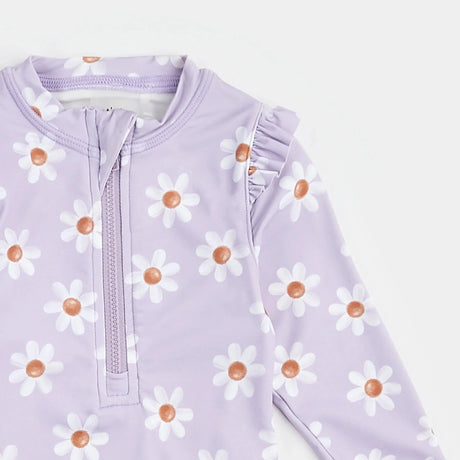 Close-up of lavender daisy long-sleeve kids swimsuit front zipper and frilly shoulder detail