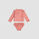 Back view of Miles The Label Deep Pink floral rashguard swim set showing long sleeves and matching bottoms.