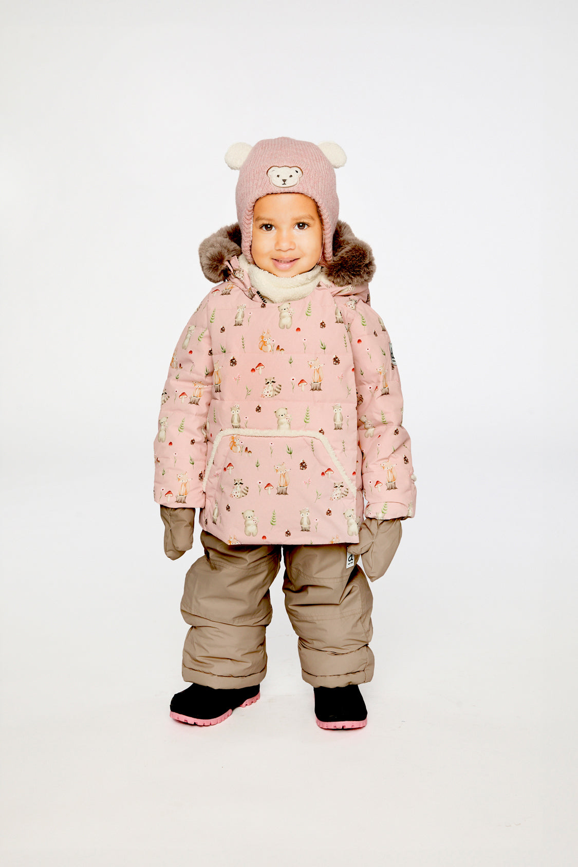 Baby wearing the Deux par Deux baby two-piece snowsuit in Pink Animal Print in a winter lookbook view