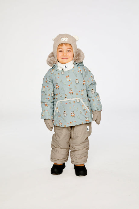 Baby wearing the Deux par Deux baby two-piece snowsuit in Blue Animal Print in a winter lookbook view