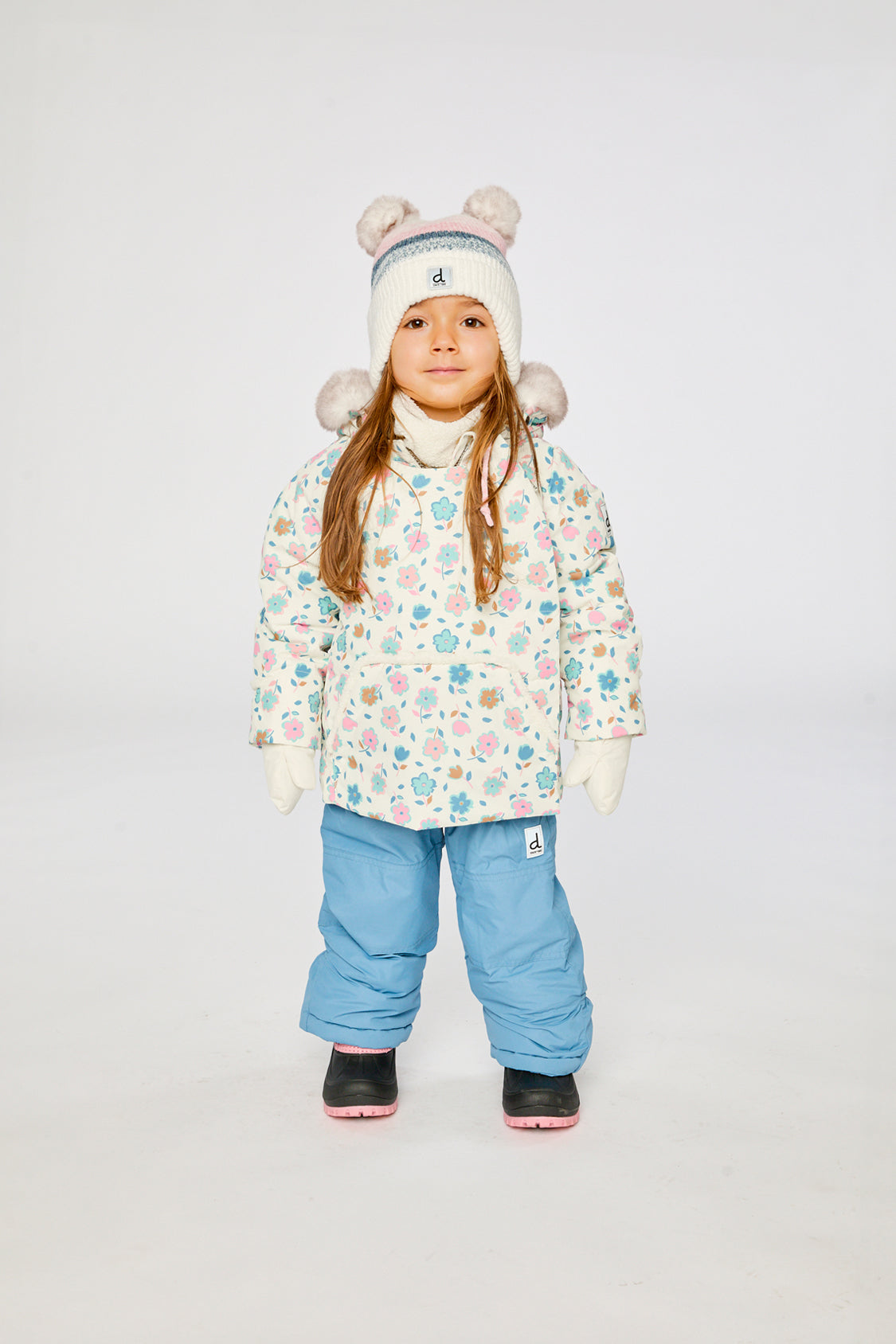 Baby wearing the Deux par Deux baby two-piece snowsuit in White with Floral Print in a winter lookbook view