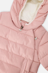 Close-up of the pale dusty pink jacket hood lining and snap front panel