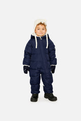 Baby boy wearing Deux par Deux Dark Blue Baby Cloud snowsuit with fleece-lined hood