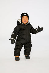 Baby boy wearing Deux par Deux Black Baby Cloud snowsuit with fleece-lined hood