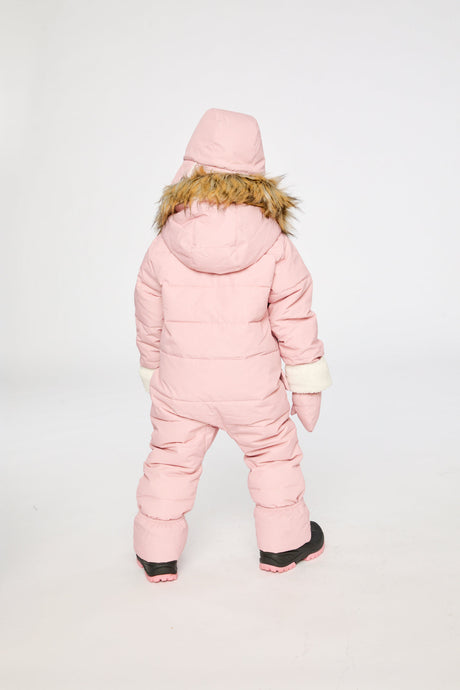 Baby girl in Deux par Deux Pale Dusty Pink snowsuit with fold-over sherpa cuffs and ankles